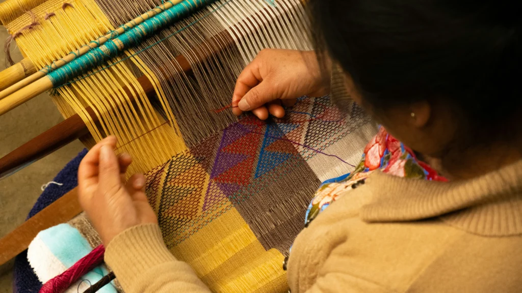artisan weaving scarves and blankets
