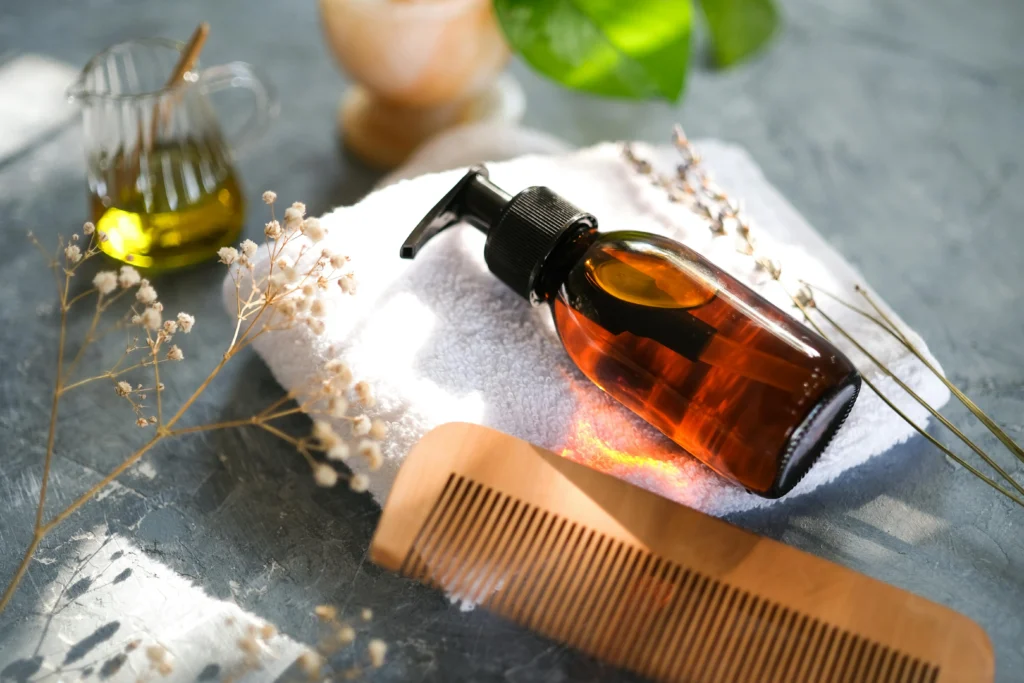 Wooden comb, beard oil, and grooming set