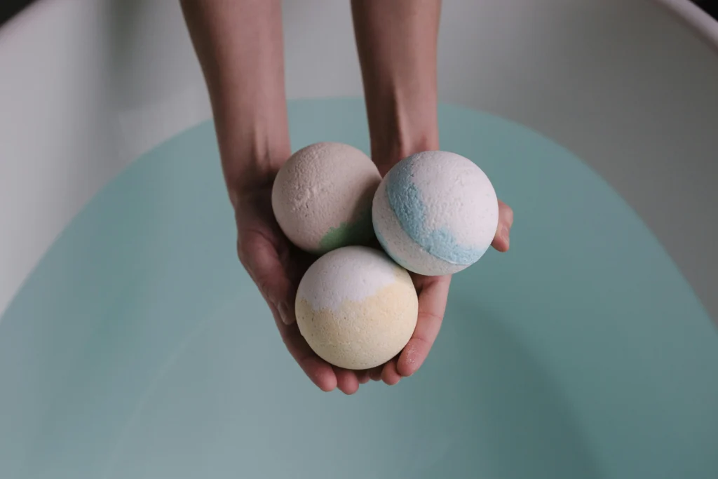 Handmade colorful bath bombs arranged on a table