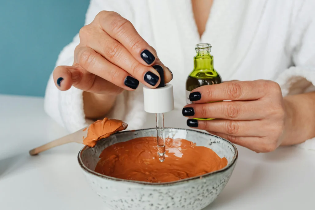 Clay facial masks in bowls with natural ingredients